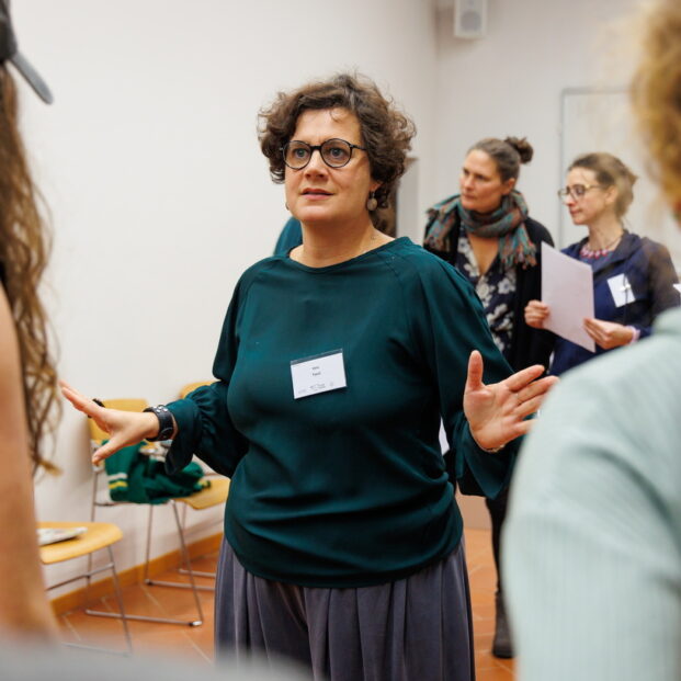 Ilaria Tucci while she is facilitating a workshop during the European Peace Research conference in Pisa (Italy), November 2024. In the picture are Ilaria Tucci and some of the workshop participants. Photo by Enrico Mattia Del Punta